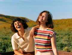 Two smiling women outdoors, radiating natural beauty and wellness.