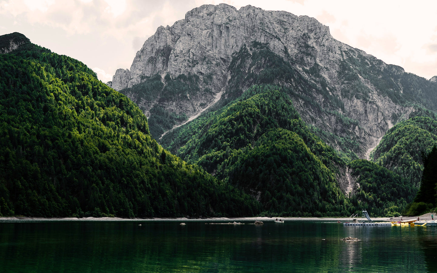 Scenic landscape with mountains, lake, and forest, symbolizing natural purity and wellness essentials.